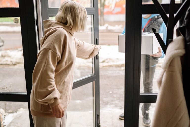 person opening front door