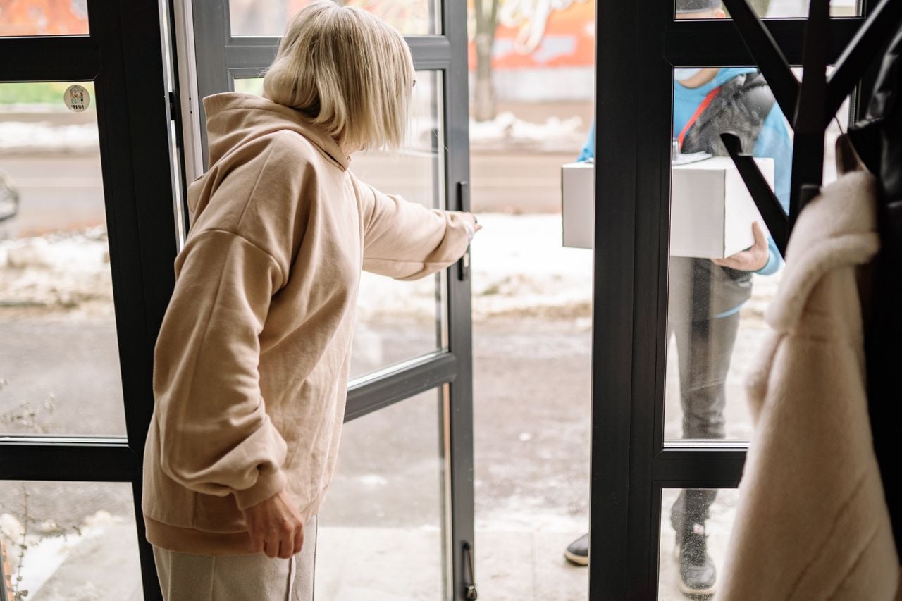 person opening front door