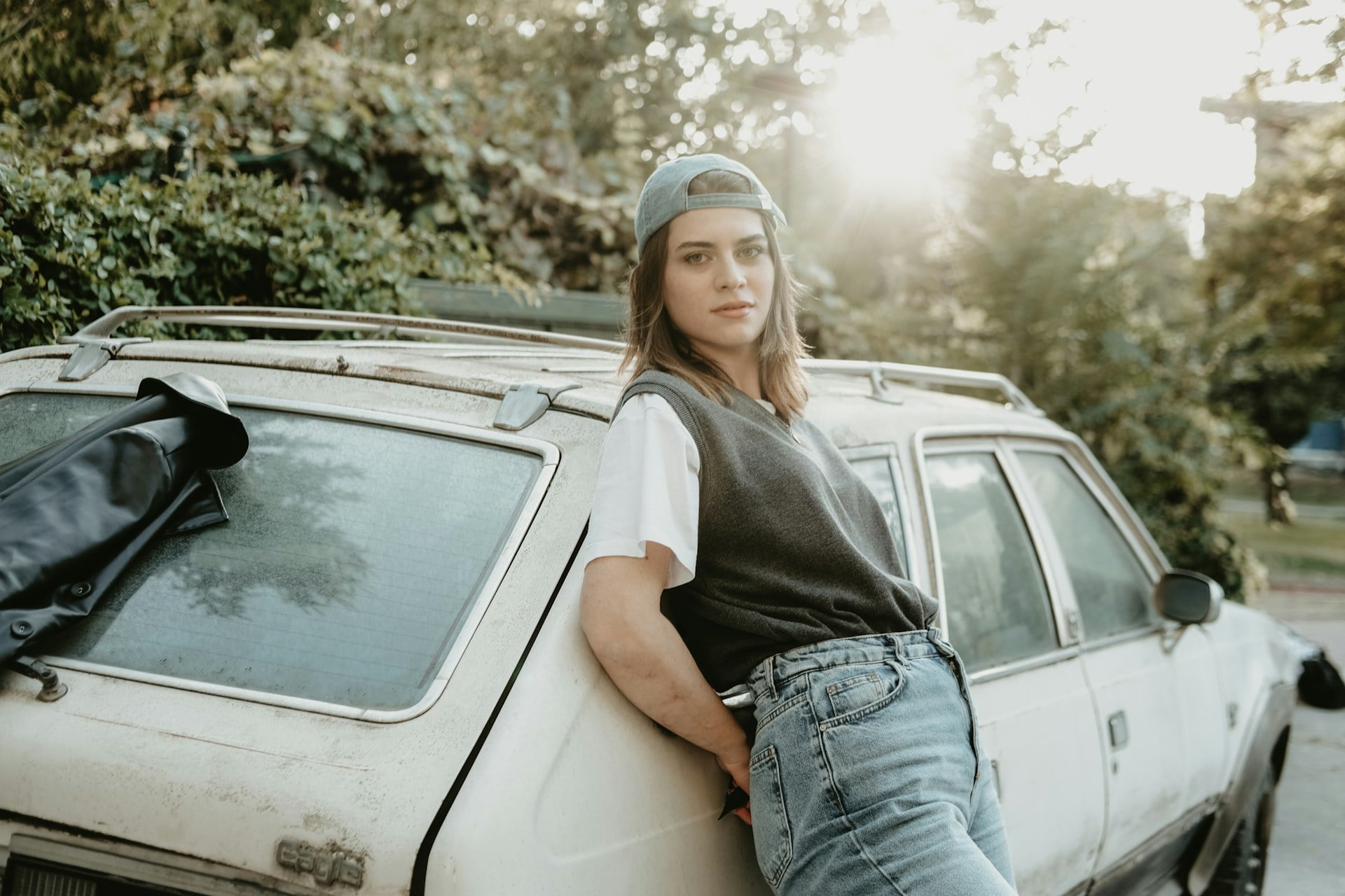woman standing next to car