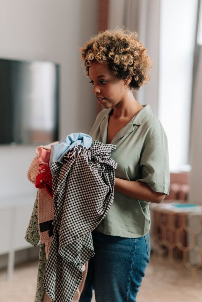 woman holding clothes