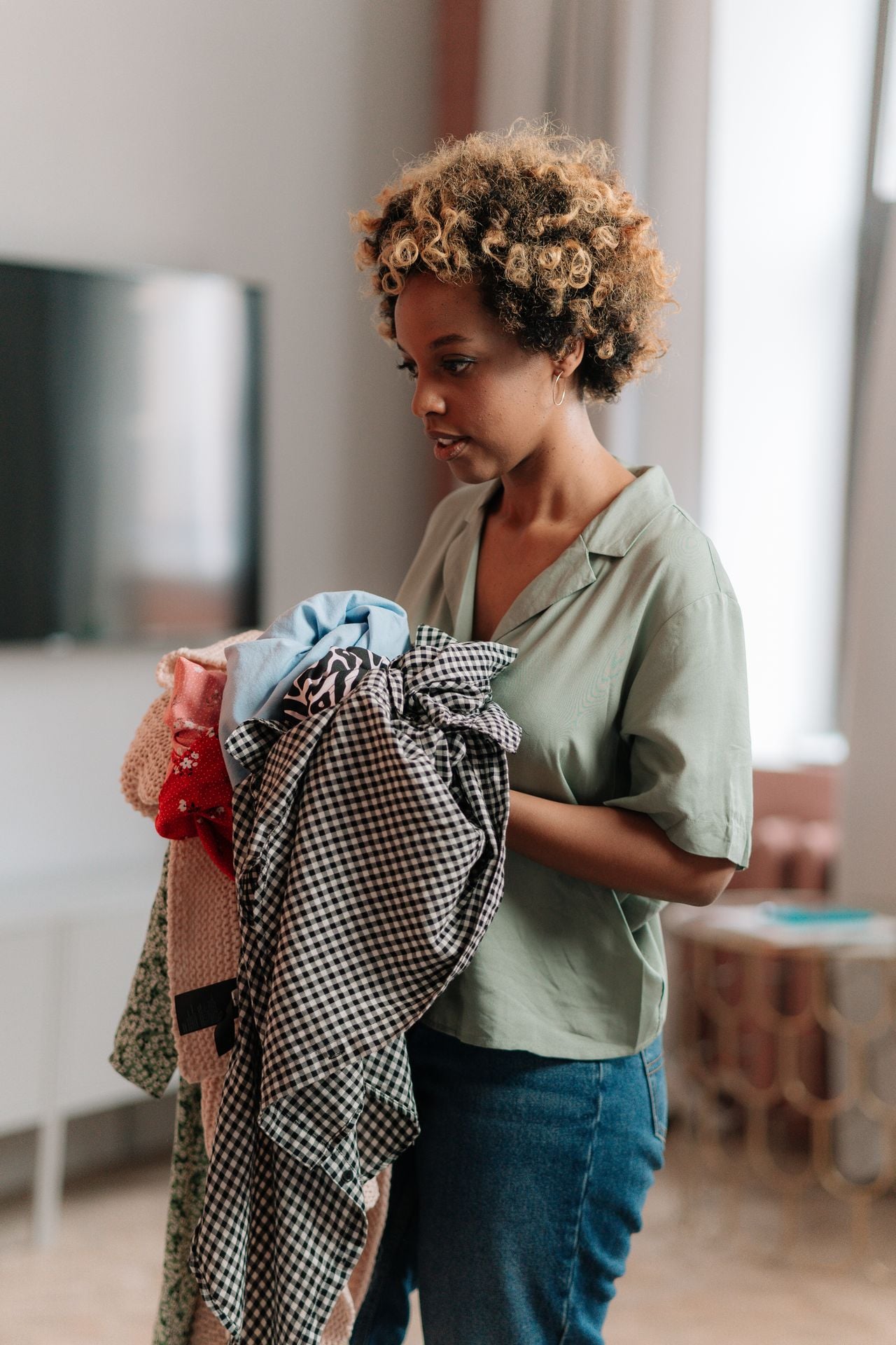 woman holding clothes