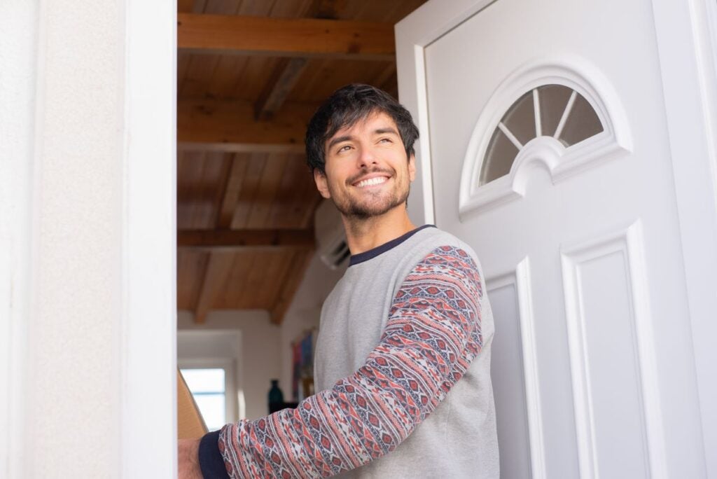 man at front door