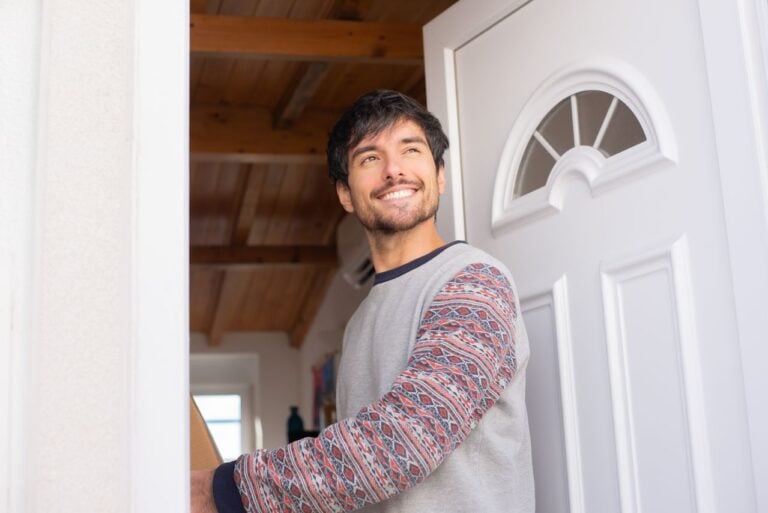 man at front door
