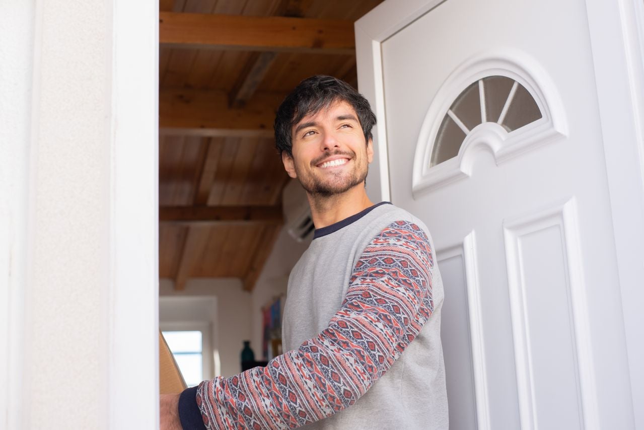 man at front door