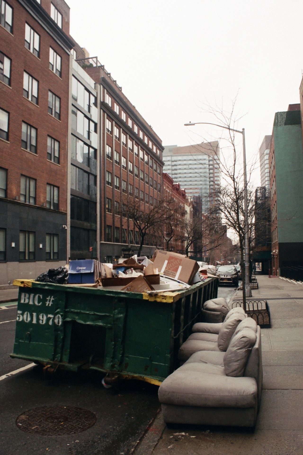 dumpster with couch